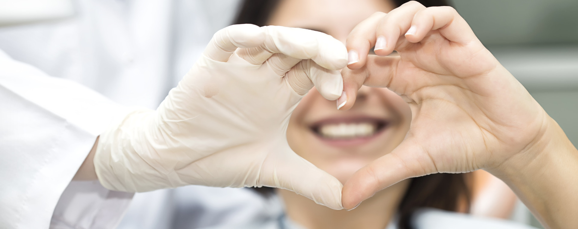 dentist with heart shaped hands